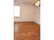 Bright bedroom featuring natural light, neutral walls, and hardwood flooring at 1641 Winton Ave, Speedway, IN 46224