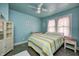 Cozy bedroom featuring ample natural light from a window and a ceiling fan at 1641 Winton Ave, Speedway, IN 46224