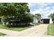 Quaint single-story home with a well-maintained lawn and detached garage at 1641 Winton Ave, Speedway, IN 46224