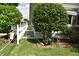 A well-manicured front yard with decorative touches frames a charming home at 1641 Winton Ave, Speedway, IN 46224