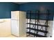 Kitchen featuring a white refrigerator and a stylish dark wooden shelf at 1641 Winton Ave, Speedway, IN 46224