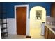 The kitchen includes a gas range, a window, and white and wood-colored cabinets at 1641 Winton Ave, Speedway, IN 46224