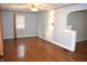 Living room featuring hardwood floors, neutral paint, and an arched doorway at 1641 Winton Ave, Speedway, IN 46224