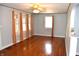 The spacious living room features hardwood floors, light gray walls, and lots of natural light at 1641 Winton Ave, Speedway, IN 46224
