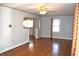 Cozy living room with hardwood floors, ceiling fan, and a decorative archway at 1641 Winton Ave, Speedway, IN 46224