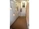 Small patio area with pebble flooring, string lights, and access door at 1641 Winton Ave, Speedway, IN 46224