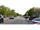 Street view showing pedestrian crossing sign, street lamps, and green trees at 1641 Winton Ave, Speedway, IN 46224