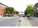 Street view of Speedway featuring red brick buildings, sidewalks, and vehicle parking at 1641 Winton Ave, Speedway, IN 46224