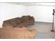 View of a cozy basement featuring a comfortable sofa and rug, perfect for relaxation or entertainment at 1641 Winton Ave, Speedway, IN 46224