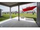 Covered back porch offers a great view of the surrounding homes and a shaded area with an umbrella at 19800 Sutton Ter, Westfield, IN 46074