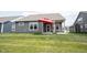 Spacious backyard featuring a covered patio with an umbrella and a well-maintained lawn at 19800 Sutton Ter, Westfield, IN 46074