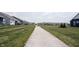 A walking path runs between the lawns of the homes in this community at 19800 Sutton Ter, Westfield, IN 46074