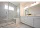 Elegant bathroom with a glass-enclosed shower, double sink vanity, and marble tile flooring at 19800 Sutton Ter, Westfield, IN 46074