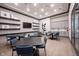 Community bistro with modern decor, featuring multiple dining tables and a television for residents at 19800 Sutton Ter, Westfield, IN 46074