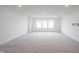 Large, bright bonus room with neutral carpet, recessed lighting, and ample natural light at 19800 Sutton Ter, Westfield, IN 46074