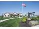 Beautiful exterior of The Retreat community clubhouse with manicured landscaping and an American flag at 19800 Sutton Ter, Westfield, IN 46074