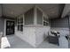 Charming front porch featuring stylish outdoor seating, brick accents, and a welcoming entrance at 19800 Sutton Ter, Westfield, IN 46074