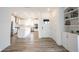 A modern kitchen features stainless appliances, an island and a view to the entry at 19800 Sutton Ter, Westfield, IN 46074
