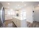 A large kitchen island provides counter space for cooking and entertaining at 19800 Sutton Ter, Westfield, IN 46074