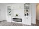 Cozy living room with electric fireplace and built-in shelving and cabinets at 19800 Sutton Ter, Westfield, IN 46074