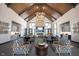 Spacious resident lounge featuring high ceilings, a fireplace, and comfortable seating areas at 19800 Sutton Ter, Westfield, IN 46074