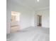 A serene primary bedroom featuring plush carpeting, and doors to a large closet and bathroom at 19800 Sutton Ter, Westfield, IN 46074