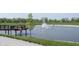 Scenic community pond featuring a fountain and walking bridge, surrounded by lush greenery at 19800 Sutton Ter, Westfield, IN 46074