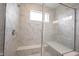Elegant tiled shower with glass enclosure and built in bench seat at 19800 Sutton Ter, Westfield, IN 46074