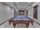 A basement with a pool table and a wet bar, ready for finishing touches and customization at 20 Forrests Edge Ct, Indianapolis, IN 46227