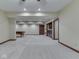 Spacious basement area with carpeted floors, recessed lighting, and a built-in bar area at 20 Forrests Edge Ct, Indianapolis, IN 46227