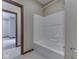 Bathroom featuring a modern tub and a view into an adjacent room at 20 Forrests Edge Ct, Indianapolis, IN 46227