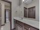 Bathroom vanity with a large mirror and a tile floor is shown in this image at 20 Forrests Edge Ct, Indianapolis, IN 46227