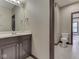 Bathroom featuring a vanity with a large mirror and a walk-in toilet area at 20 Forrests Edge Ct, Indianapolis, IN 46227