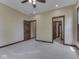 Spacious bedroom with recessed lights, a ceiling fan, and doorways to the hall and bath at 20 Forrests Edge Ct, Indianapolis, IN 46227
