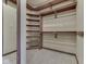 Well-organized closet featuring wooden shelving and clothing rods for optimal storage at 20 Forrests Edge Ct, Indianapolis, IN 46227
