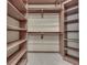 Spacious closet with built-in wooden shelving and clothing rods for efficient organization at 20 Forrests Edge Ct, Indianapolis, IN 46227