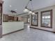 Open concept dining space with view to the kitchen and outdoor sun room at 20 Forrests Edge Ct, Indianapolis, IN 46227