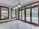 Dining room boasts lots of light, tiled floors, and sliding doors leading to the deck at 20 Forrests Edge Ct, Indianapolis, IN 46227