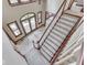 Grand foyer featuring a staircase, arched windows, and tile flooring, creating a welcoming entrance at 20 Forrests Edge Ct, Indianapolis, IN 46227