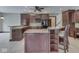 Open concept kitchen with dark wood cabinets, granite countertops, and breakfast bar at 20 Forrests Edge Ct, Indianapolis, IN 46227