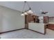 Open concept kitchen with dark wood cabinets, granite countertops, and tiled floors at 20 Forrests Edge Ct, Indianapolis, IN 46227