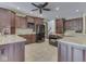 Spacious kitchen with dark wood cabinets, granite countertops, and modern appliances at 20 Forrests Edge Ct, Indianapolis, IN 46227