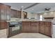 Kitchen featuring granite countertops, island with oven, and tiled flooring at 20 Forrests Edge Ct, Indianapolis, IN 46227