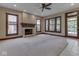 Bright and airy living room with a fireplace and large windows overlooking the yard at 20 Forrests Edge Ct, Indianapolis, IN 46227