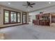 Open-concept living room connecting to kitchen with dark wood cabinets and natural light at 20 Forrests Edge Ct, Indianapolis, IN 46227