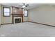 Living room featuring a fireplace with a decorative mantle and a window on each side at 20 Forrests Edge Ct, Indianapolis, IN 46227