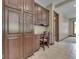 Home office space features desk, drawers, and custom wood built-ins at 20 Forrests Edge Ct, Indianapolis, IN 46227