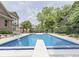 Backyard pool with mature trees and manicured landscaping at 20 Forrests Edge Ct, Indianapolis, IN 46227
