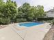 Backyard pool with mature trees and meticulously kept landscaping at 20 Forrests Edge Ct, Indianapolis, IN 46227