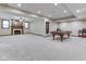 Large recreation room with a fireplace, pool table, and ample space for entertaining at 20 Forrests Edge Ct, Indianapolis, IN 46227
